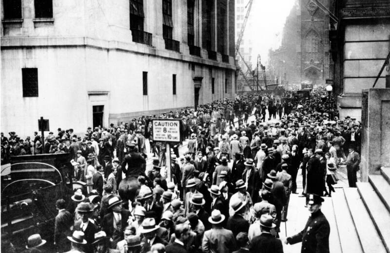 Crowds gathering on Wall Street outside the New York Stock Exchange