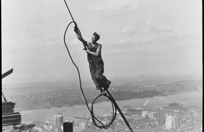 Lewis Hine photograph of a worker on a cable high above New York during construction of the Empire State Building, 1930