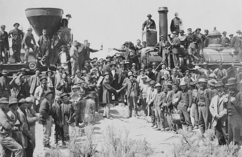 East and West shaking hands at the laying of the last rail of the Union Pacific Railroad, 1869